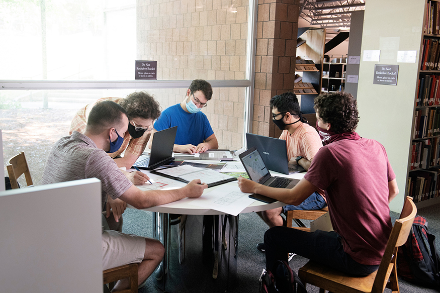 5 students work around a table