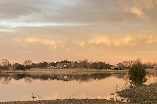 Photograph of a lake at sunset.