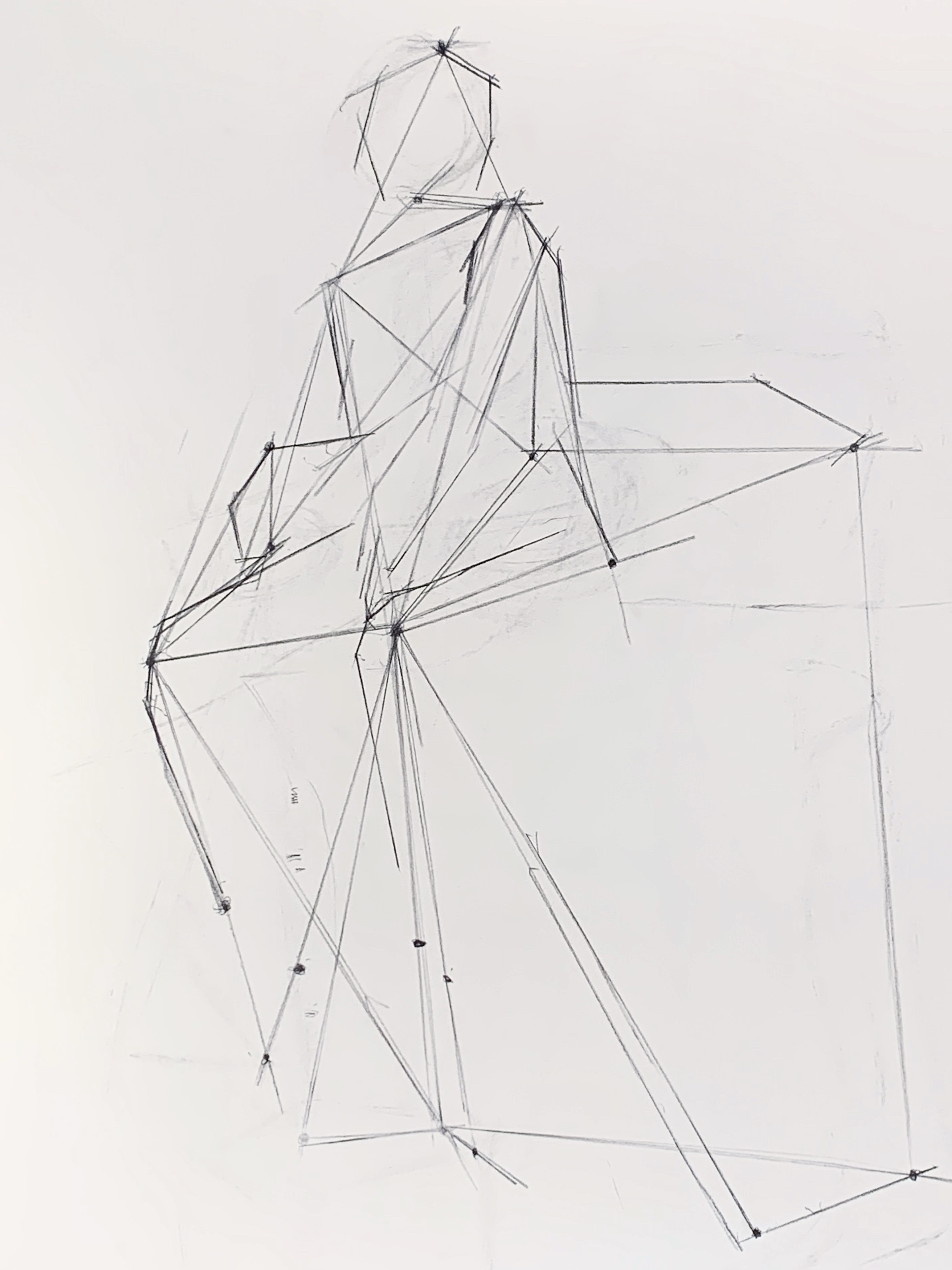 A drawing composed of several lines, outlining the gesture figure of a human- including angles, proportions, and spatial relationships, drawn in vine charcoal.