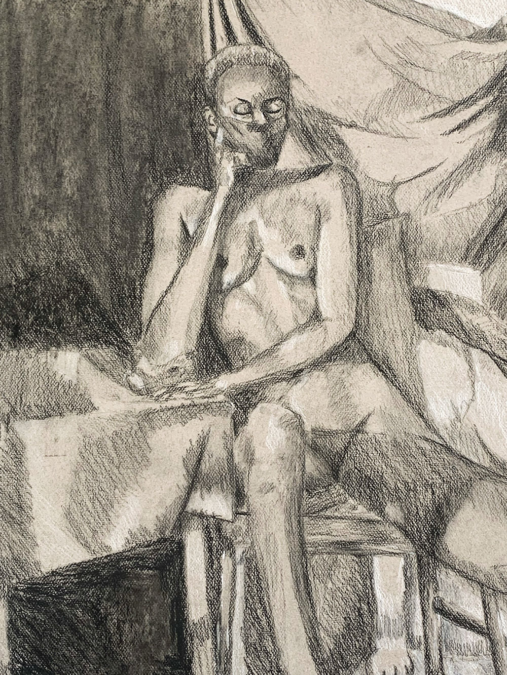 A naked woman model is drawn using the heightened value technique- applying light and dark material to a gray toned surface. 