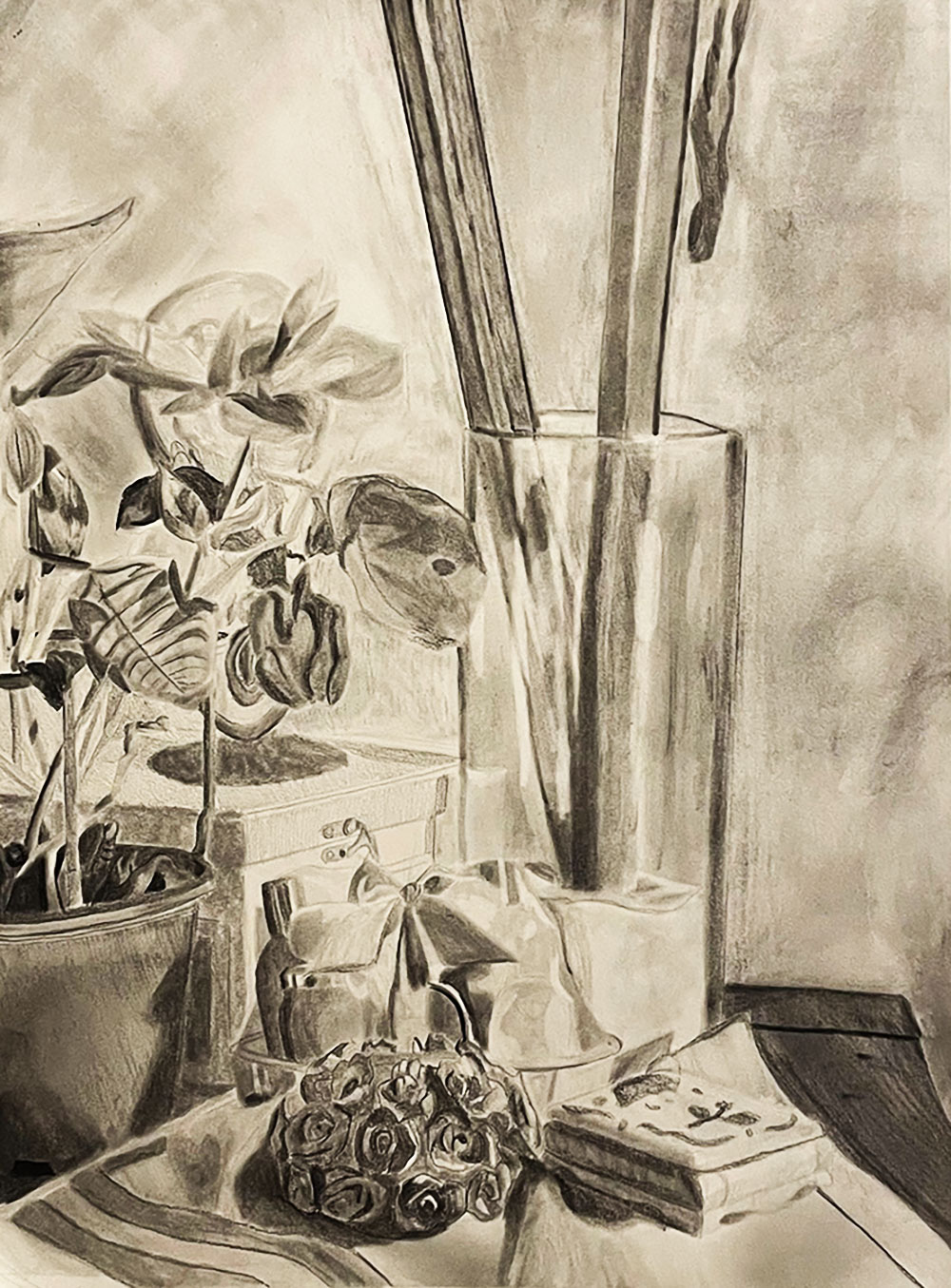 Charcoal drawing of still life includes: a vase of flowers, leaves, and a tablecloth
