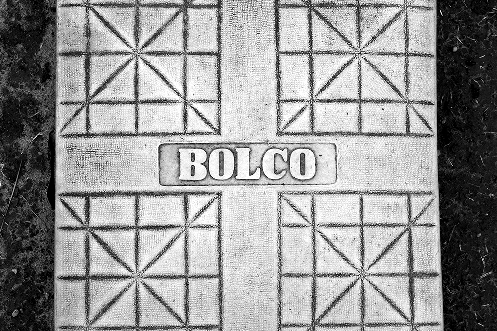 A black and white photographed image of a baseball home plate.