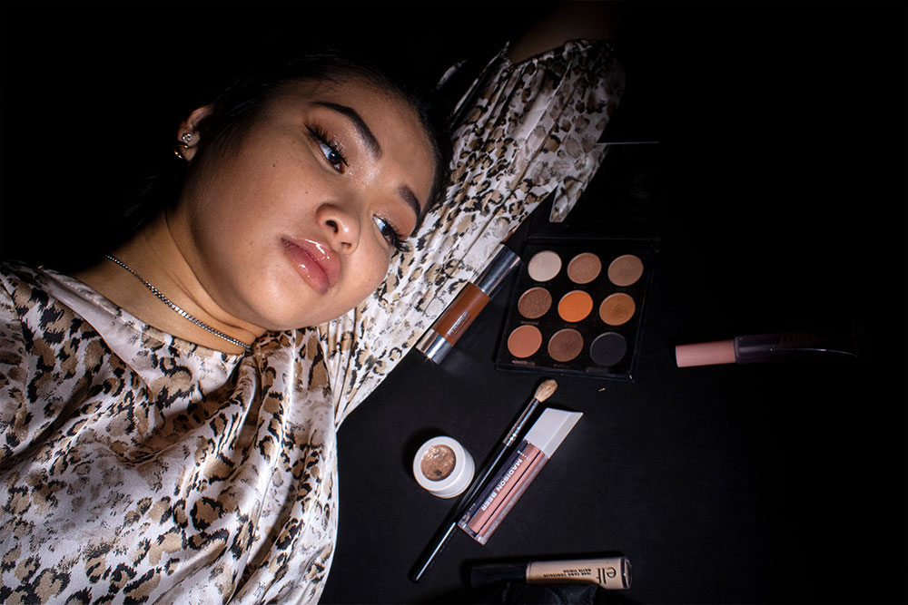 A photographed image of girl lying on makeup.