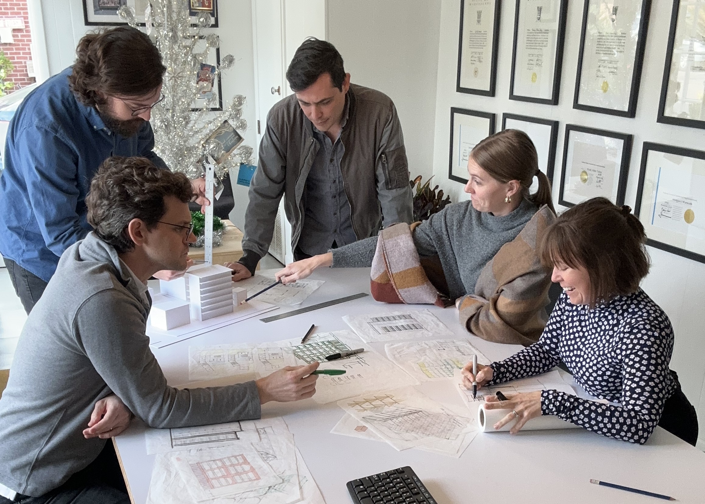 Tall Architects group works at table