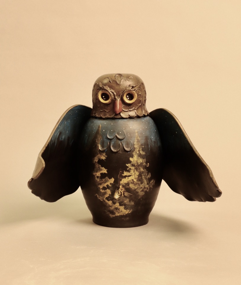 Ceramic owl with camping scene painted on body