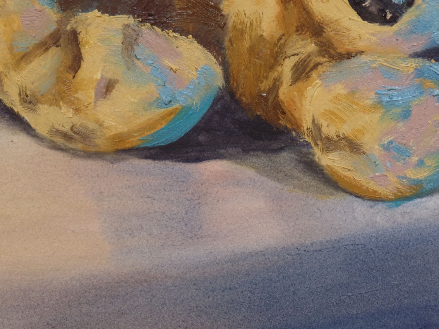 Close up of a painting of a stuffed animal's limbs
