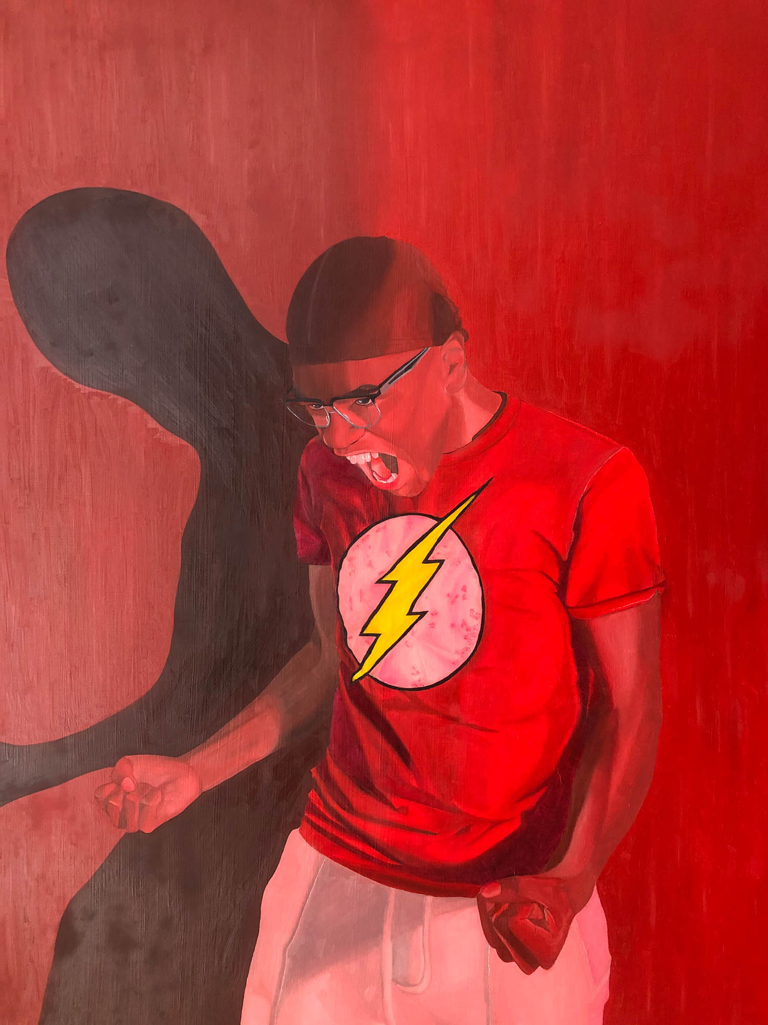 African American male friend emphasizing an emotion of anger. Wearing a warm red colored shirt, with warm white colored pants. Incorporating multiple areas of warm tone reds onto the skin of the face, neck, hands, and arms. Also, having a shade silhouette behind the male figure. Warm and cool tones of reds on the background to compliment both the figure and the emotion of anger. Detailed and textural areas within the shirt, shorts, arms, face, and background.