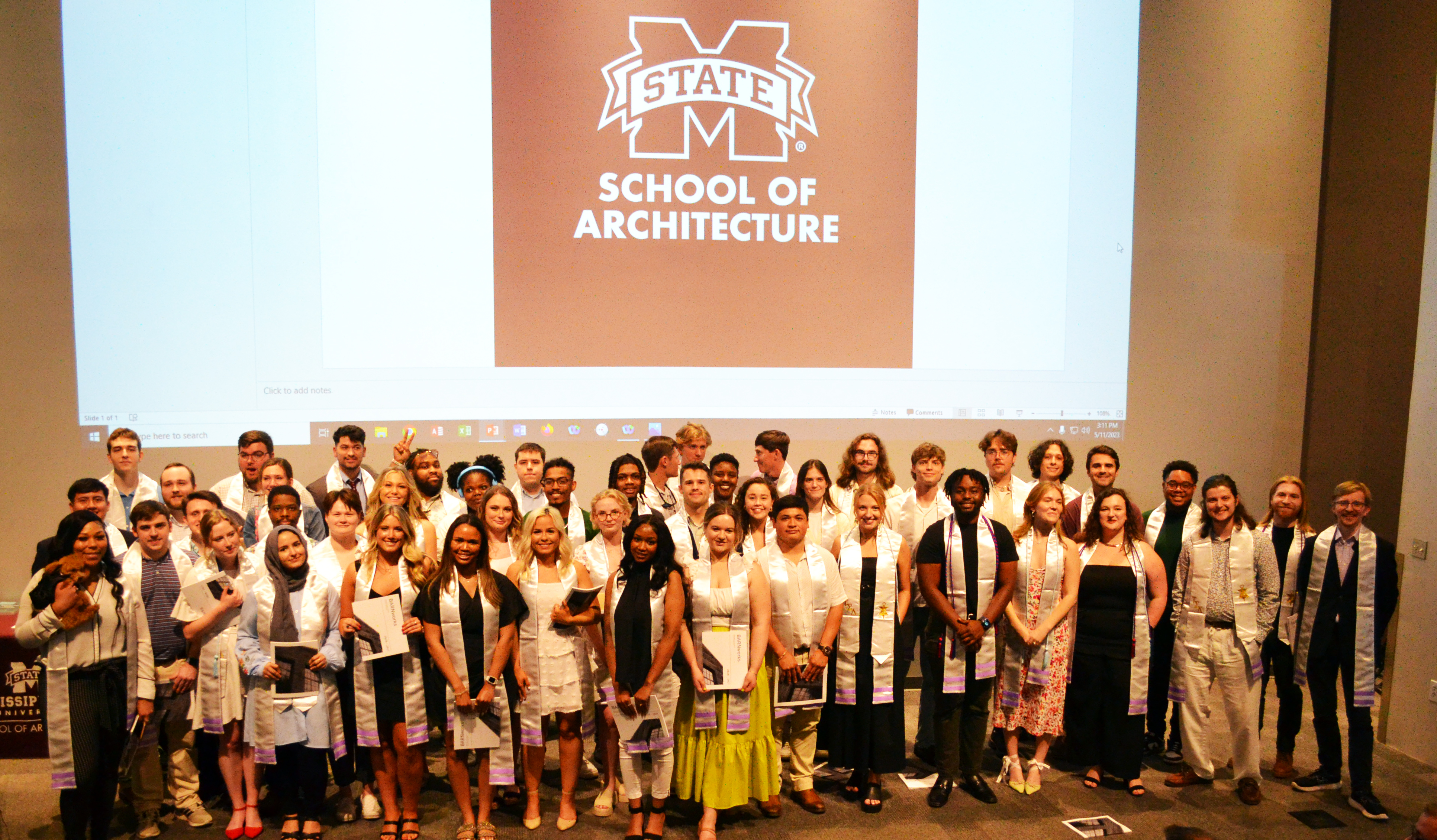 MSU School of Architecture class of 2023 gathered on stage for photo
