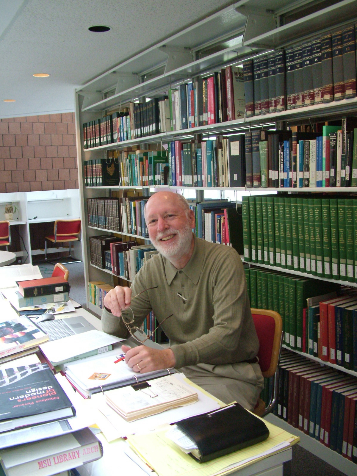 Michael Fazio poses for a photo in the Bob and Kathy Luke Library in Giles Hall