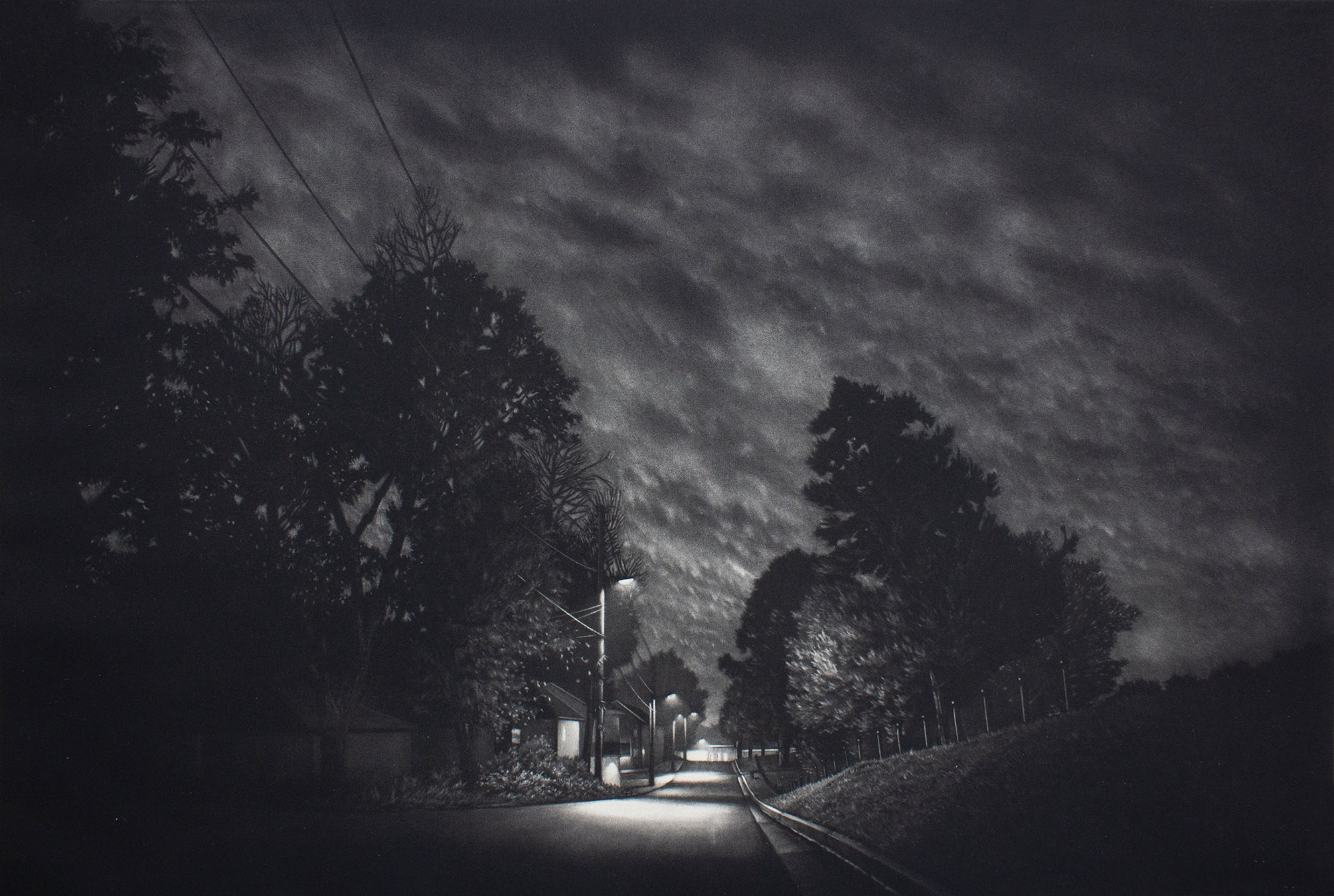 “Drift,” a 12-by-18 mezzotint by MSU Assistant Professor of Art Jacob Crook, street surrounded by trees at night shows 