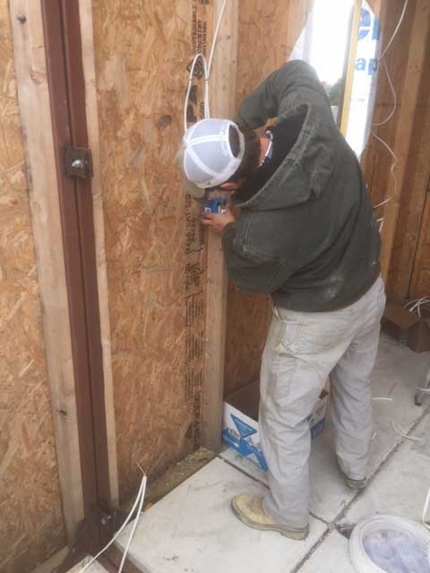 Mississippi State students in BCS 3212 Electrical Systems wired a tiny house built by first-year students