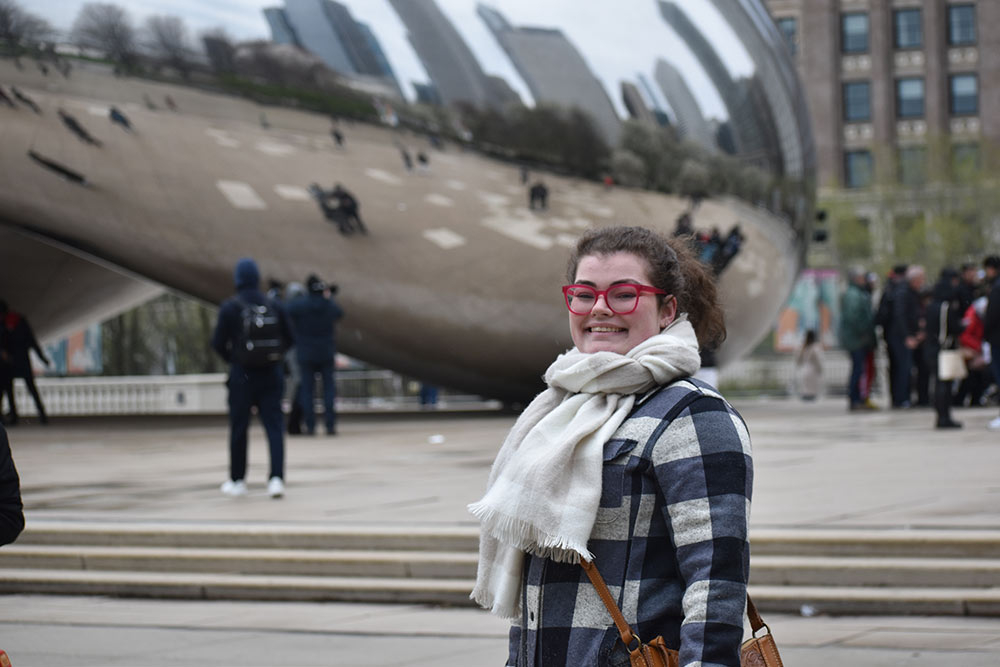 Sarah Mixon stands in front of The Bean sculpture in Chicago