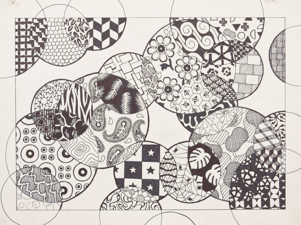 Black and white patterned drawing overlapped by various circles.