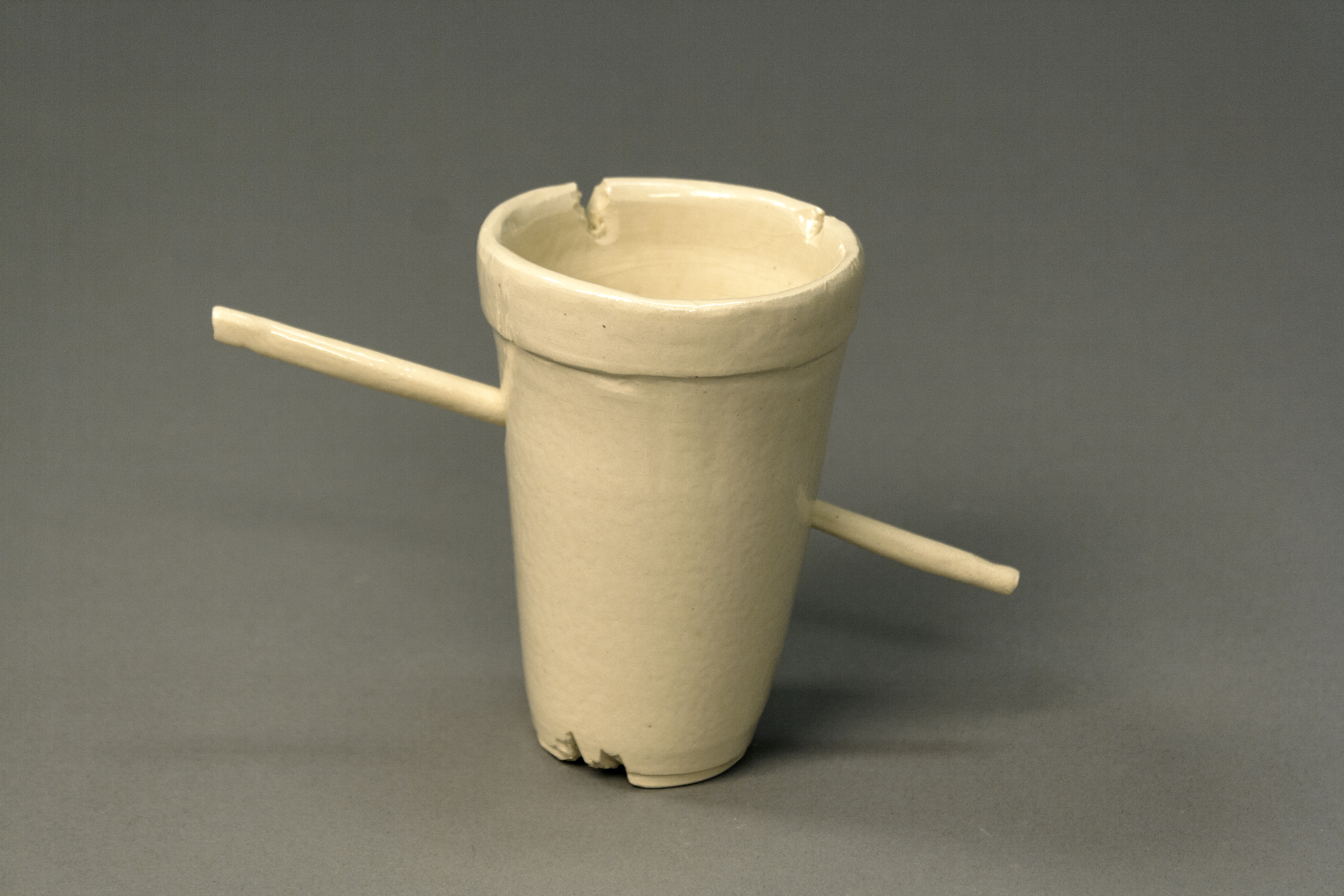 detail of cup with straw through it.