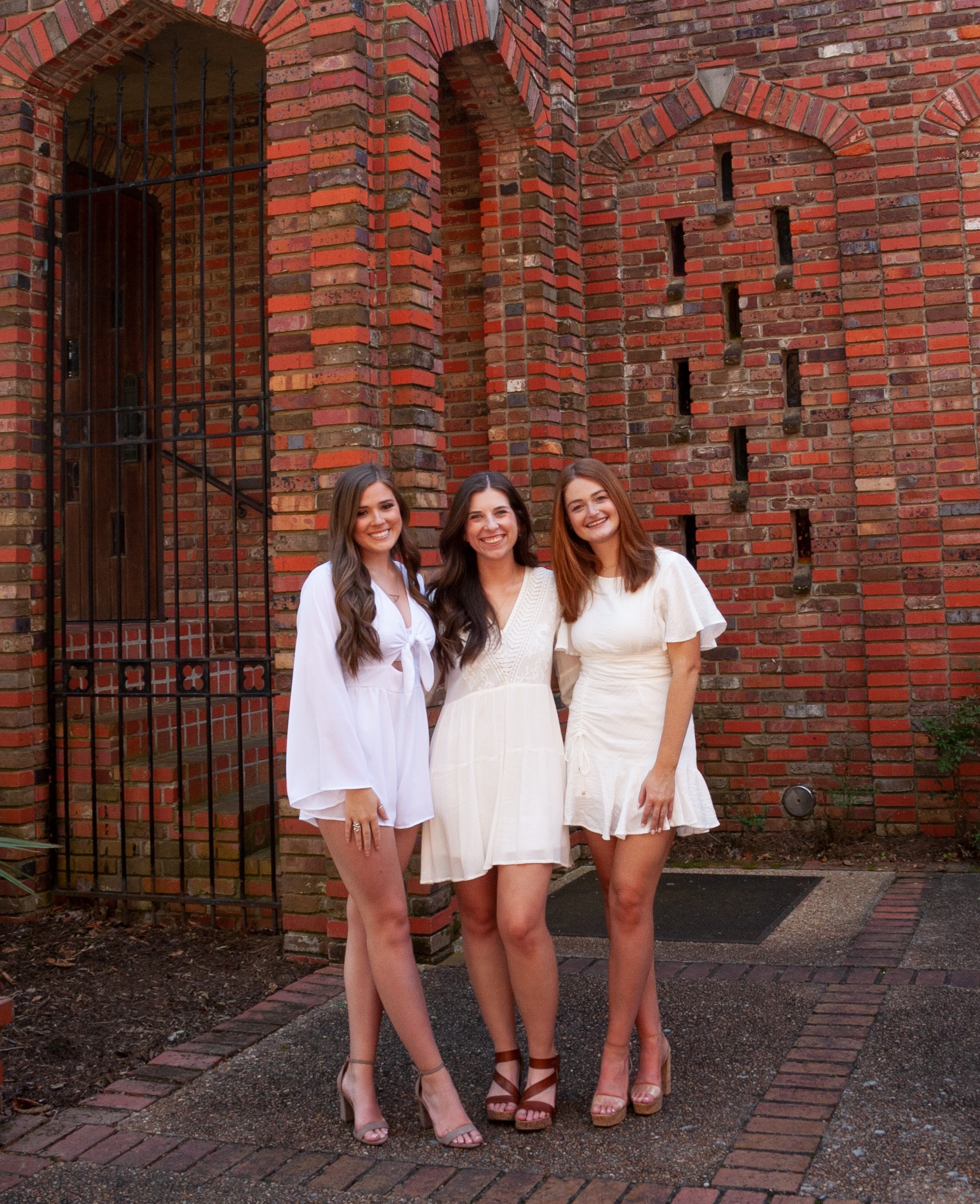 From left to right, Mississippi State interior design seniors Abigail Roberts, Anna Madison and Hayley Wilson pose in front of the Chapel of Memories. 