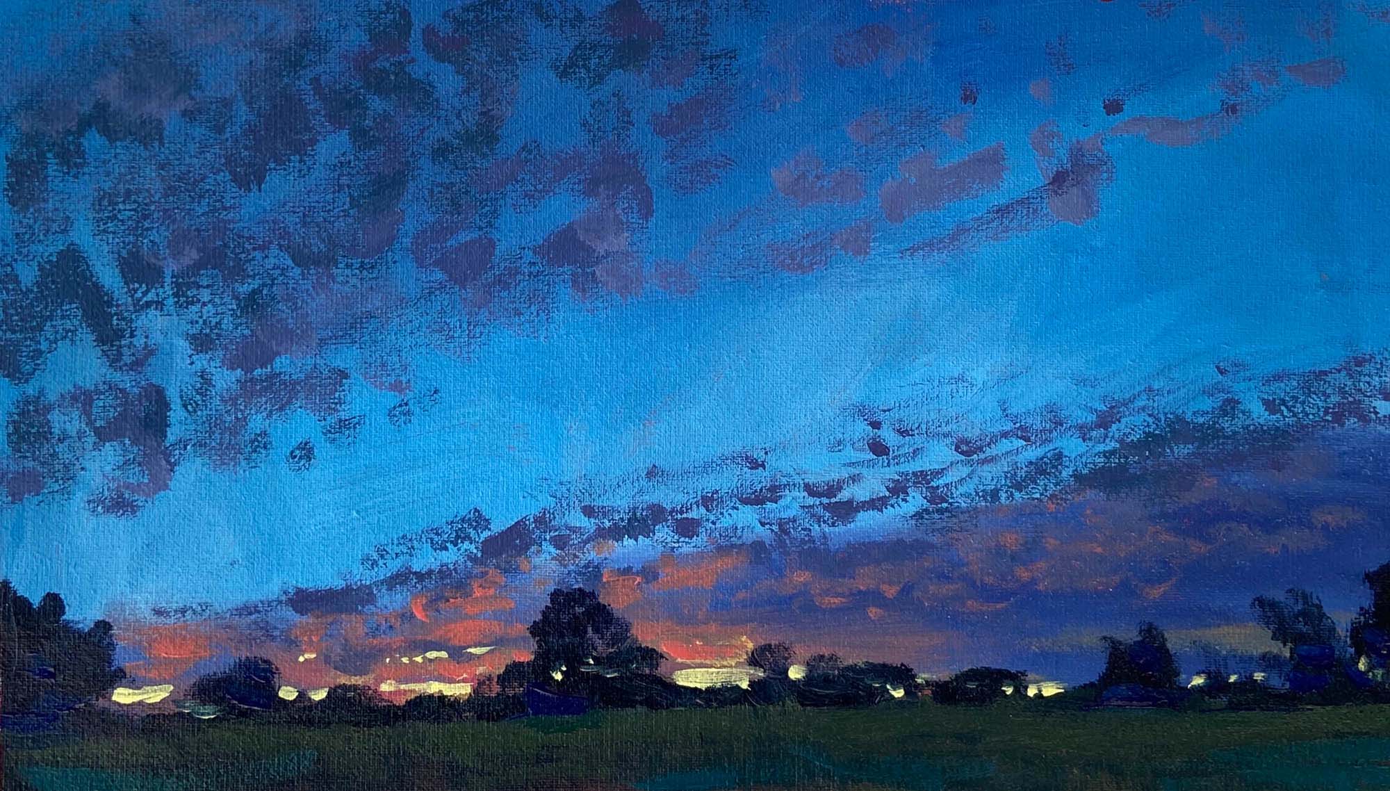 Sunset scene with treetops and clouds