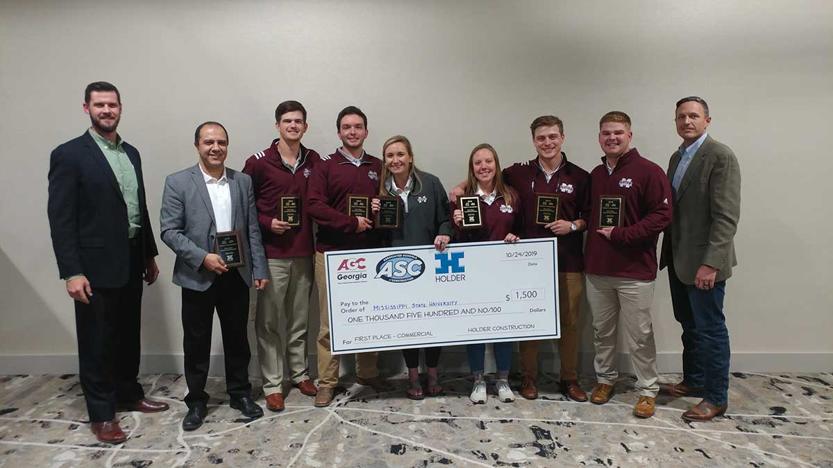 Pictured left to right are Raleigh Flowers, a representative from sponsor Holder Construction; MSU Assistant Professor Saeed Rokooei; Jake Roberson of Brookhaven; Hunter Henderson of Brandon; Kacie Lynn James of Grenada; Jalyn Wallin of Double Springs, Alabama; Steve Dragoo of West Point; Noah Heflin of Macon; and Steven Hunter with Holder Construction. 